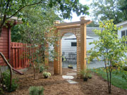 Laurie McRostie designed this back yard with trellis.
