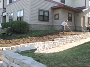 Extending the natural stone wall solved a grading problem and looks great in the 2700 block of Portland Ave S.